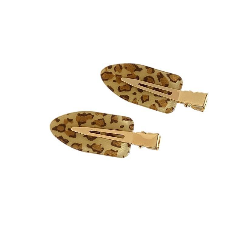 Korean version of retro fashionable leopard print seamless oval hairpin personalized versatile makeup edge clip hair accessories
