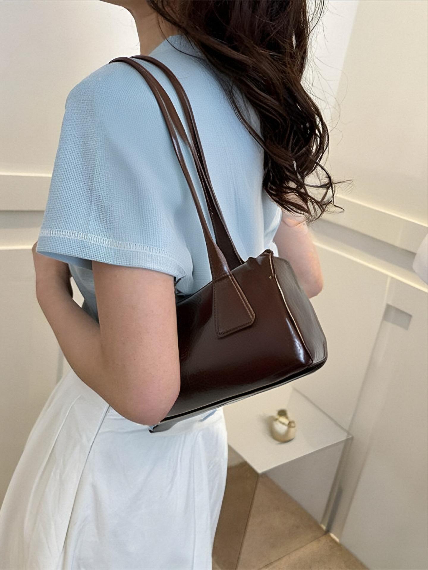 

Bag women s 2025 summer new Korean ins retro baguette bag versatile commuter casual shoulder armpit bag кофейный