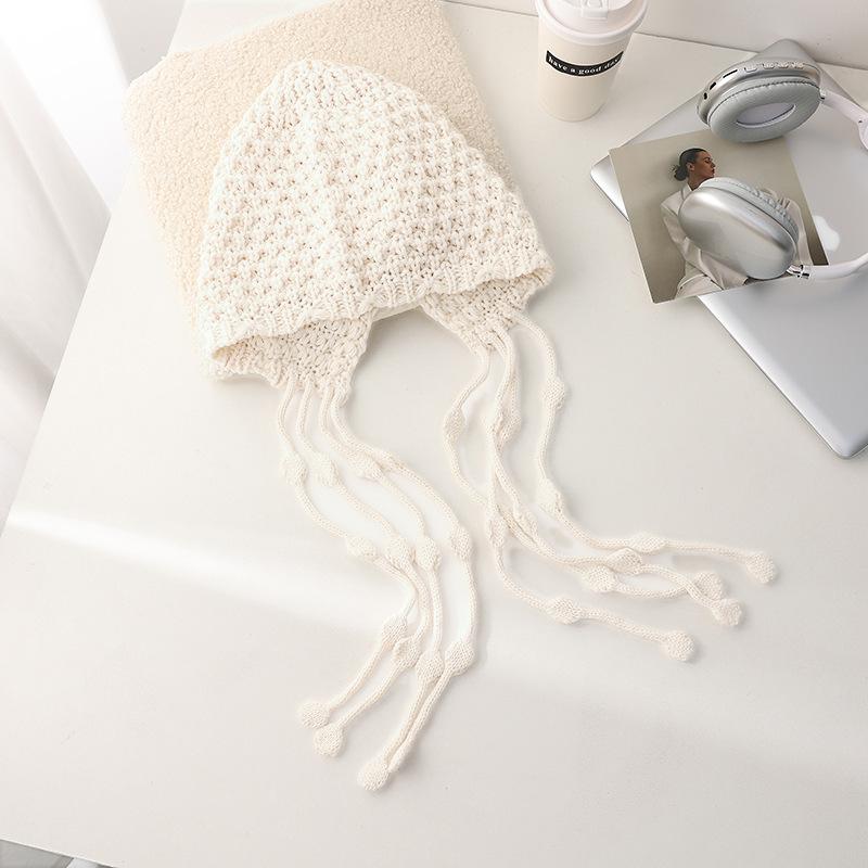 Autumn and winter lace-up ear protectors knitted hat women's Fair Island wind bag head hairball hat thickened warm jacquard wool hat