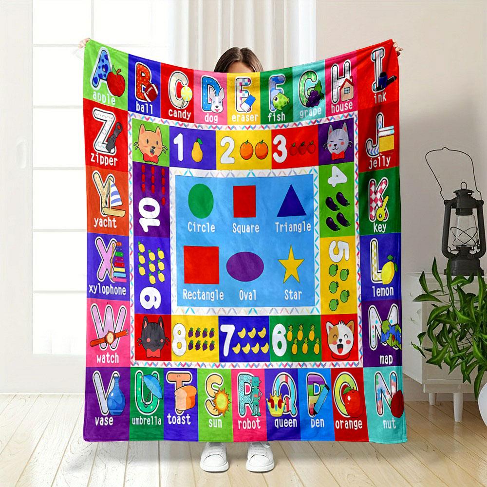 The pattern consists of letters, numbers, shapes, and corresponding images. for all seasons blanket lunch break throw gift