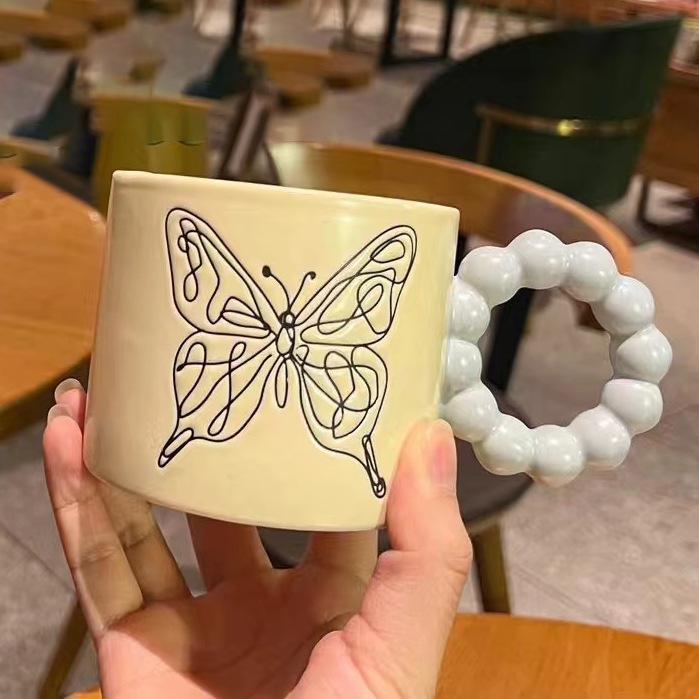 

Керамическая чашка высокой ценности Персонализированная креативная кружка Чашка с бабочкой Чашка для воды Чашка с ручкой-жемчужиной Чашка для послеобеденного чая Офисная чашка 301-400ml