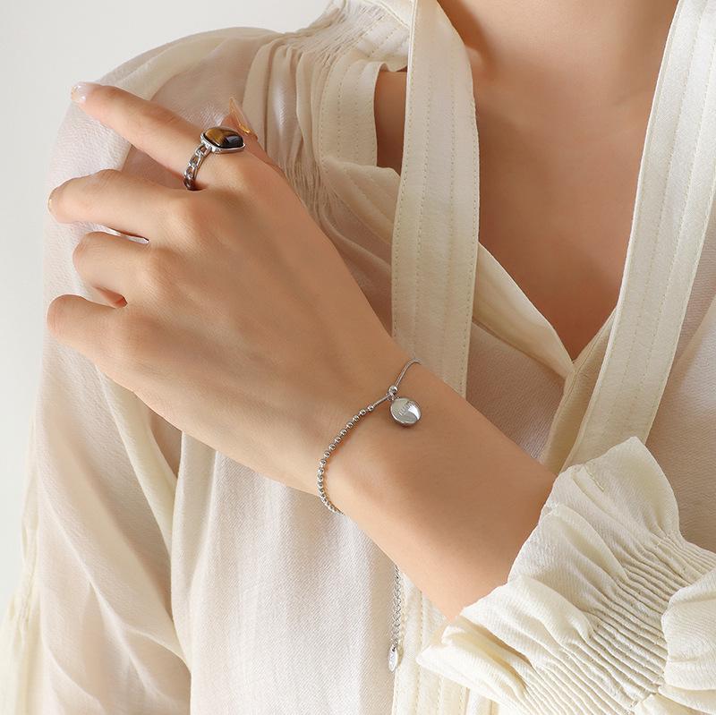 Korean Fashion Round Pendant Engraved Bracelet in Gold-Plated Titanium Steel