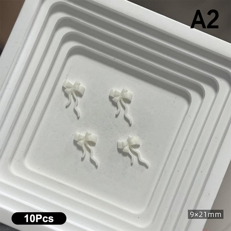 10 Stück Doppellagige Schleifen-Nagelanhänger 3D Süße Band-Schleifen Nagelkunst Strasssteine Mini Harz-Fliege Maniküre Schmuck DIY Teile