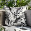 Black and white leaf print throw pillowcase, machine washable polyester material, suitable for living room and bedroom decor.