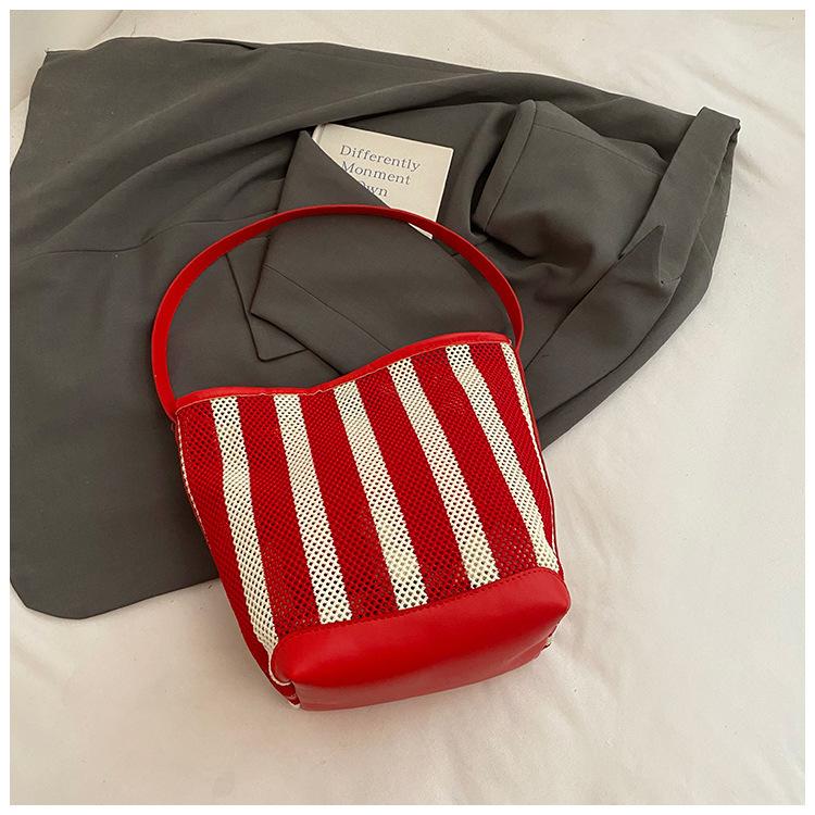 

Bucket bag women s new fashion striped hollow shoulder bag large capacity vacation tote bag tide