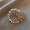 Women's round pearl and rhinestone brooch, Baroque style, modern elegance, butterfly design, suitable for parties and weddings.