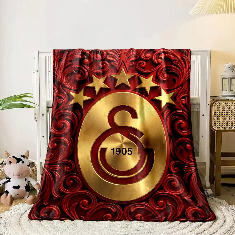 Golden emblem with "1905" and stars, surrounded by red floral patterns. for all seasons blanket lunch break throw gift