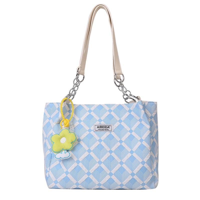 

В начале лета новая простая повседневная женская сумка-тоут ромбовидной формы большой вместимости — это универсальная сумка через плечо для студентов на занятия. синий