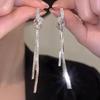Elevate Elegance with 2024's Silver Zircon Tassel Knot Earrings — a Uniquely Designed Luxury for Women.