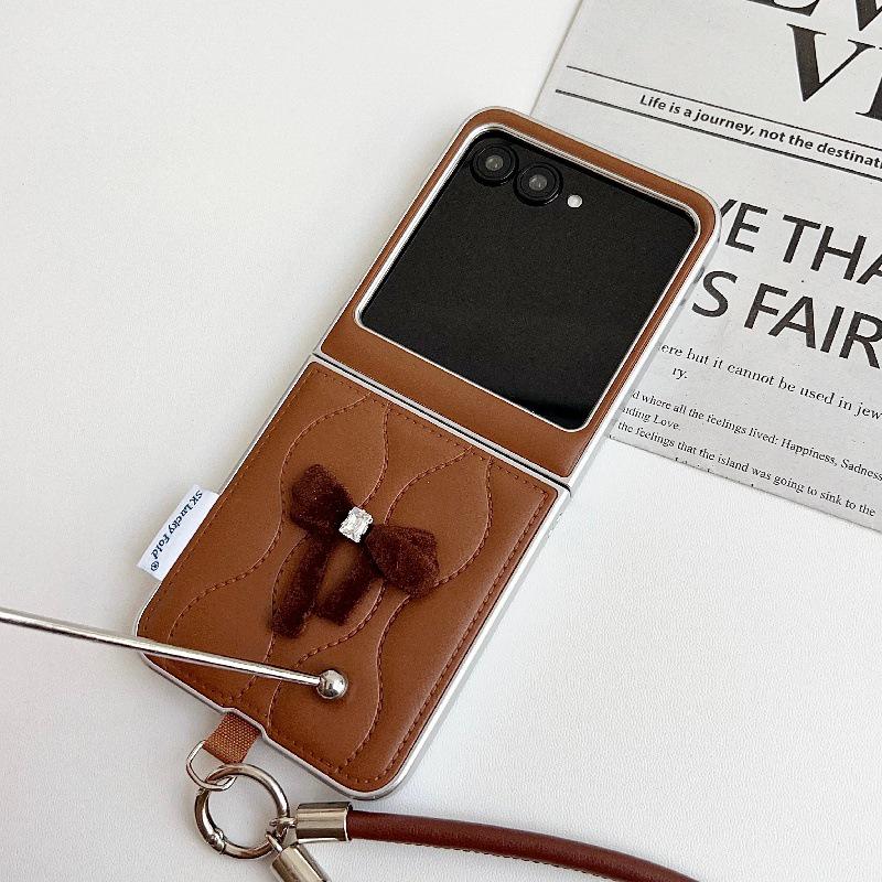 Fashionable Bowknot Motorola Razr60 Drop-proof Foldable Phone Case with Anti-lost Rope.