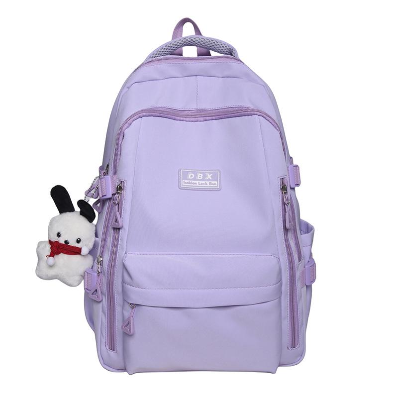 

New backpack schoolbag female college student solid color simple high school college student junior high school student burden reduction fashion фиолетовый