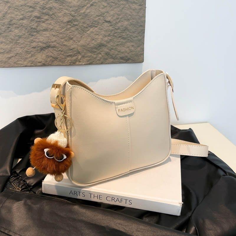 Textured versatile bucket bag women's new trendy Korean version fashionable wide shoulder strap foreign style single shoulder oblique A