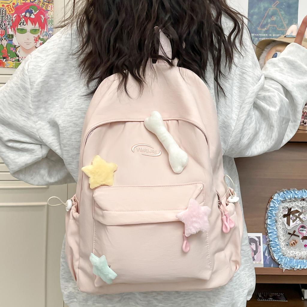 Solid color simple casual backpack female niche design sense lightweight size backpack class primary and secondary school students schoolbag