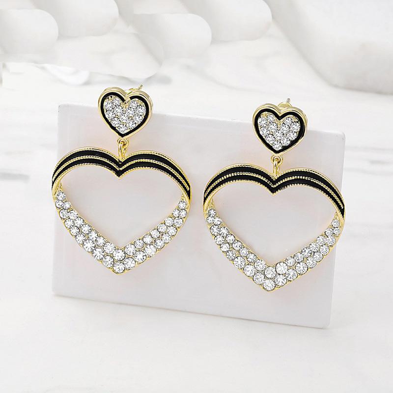 

Легкие роскошные женские серьги-сердечки с висячими циркониями, модные изысканные полые ювелирные изделия, кулон 2024, повседневные серьги в Корейском стиле
