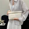 Large capacity new temperament fashionable design foreign style solid color straw woven texture hand envelope women's bag