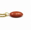 Peach coral oval pendant with 18K gold hardware gift wrapping and gift tag Includes a 45cm plated chain be changed to an 18K gold chain Undyed coral