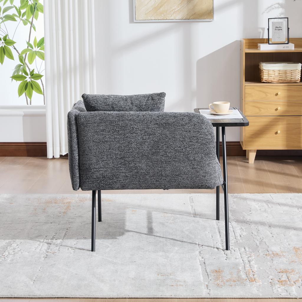 Modern single armchair with comfortable fabric backrest and two storage compartments, complemented by a practical side table.