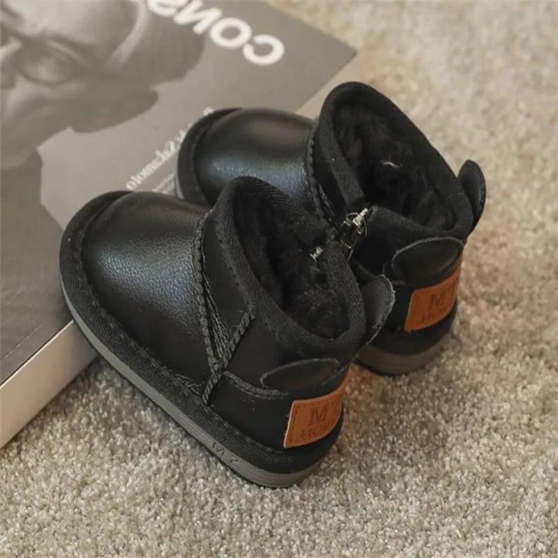 

Дитячі зимові черевики 2024 Зима Нові Плюшеві Водонепроникні Протиковзкі Дитячі Зимові Чоботи для Малюків Хлопчиків та Дівчаток Потовщені Плюшеві Короткі Чоботи 23 чорний