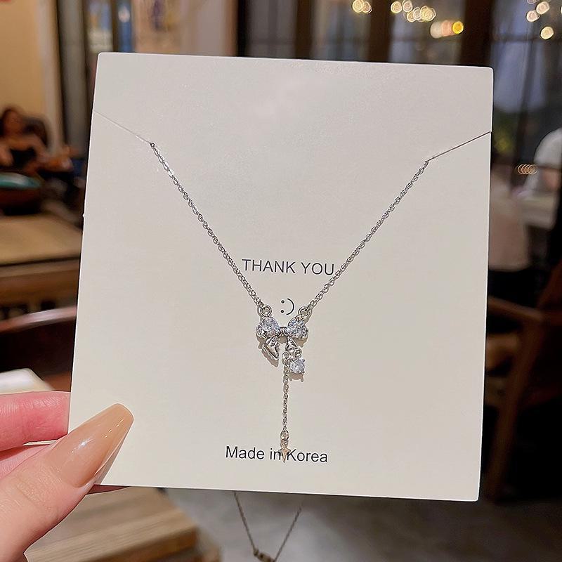 "Elegant Korean Titanium Steel Zircon Bow Necklace for Women"