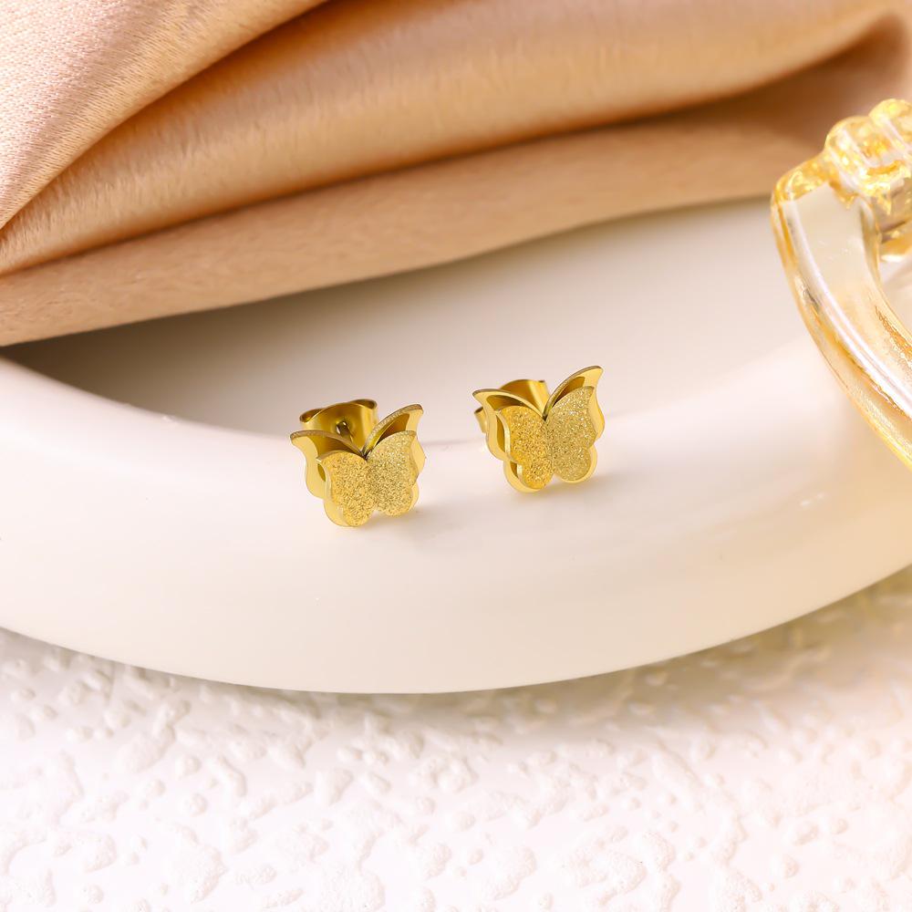 

Trendy Titanium Steel Frosted Butterfly Jewelry Set: Double-Layer Necklace, Bracelet, Earrings, and Ring.