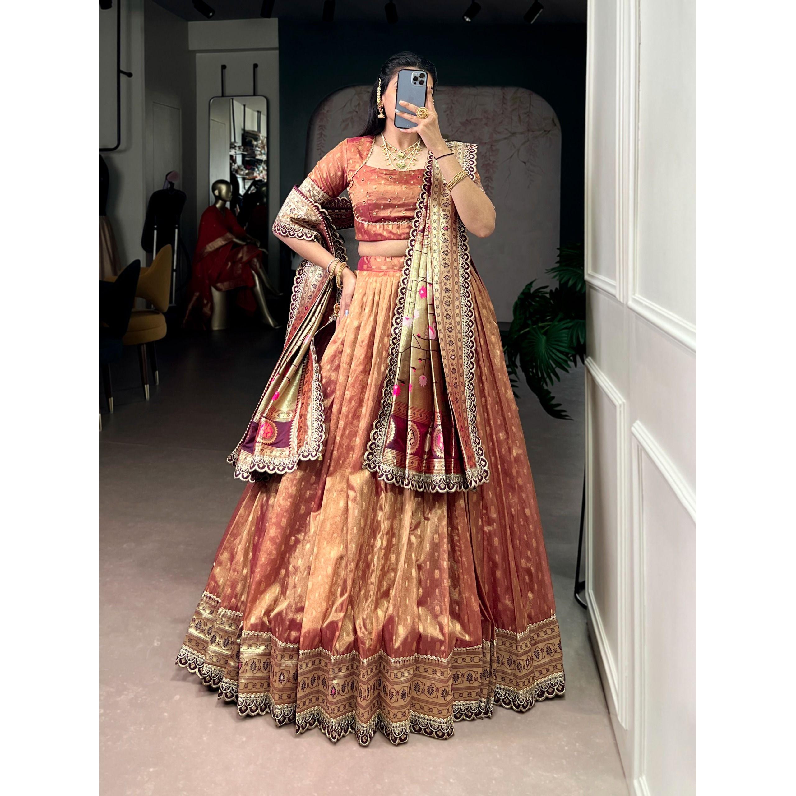 This shimmer organza lehenga choli adorned with zari weaving and delicate lace borders brings timeless elegance to every festive moment FREE