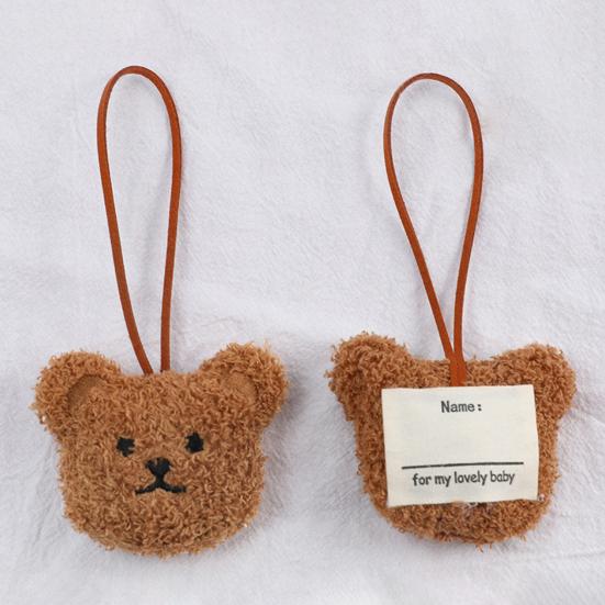 Precioso llavero con decoración de oso y cabeza con tacto acogedor
