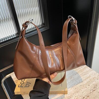 Sac design niche français pour femmes 2026 nouveau mode sac baguette sous le bras texture sac à bandoulière polyvalent