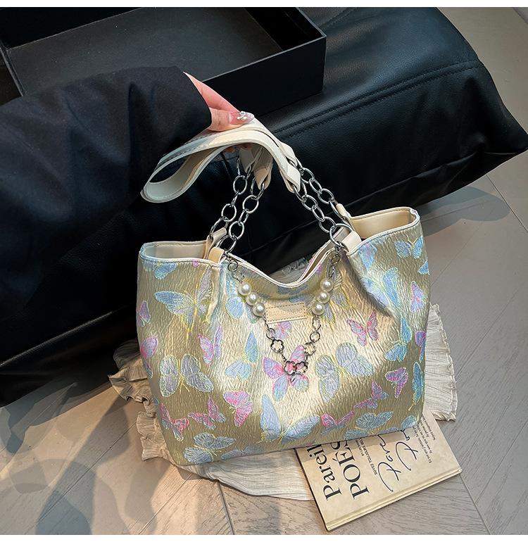 

Large capacity bag women s 2025 new national style fashion flower embroidered canvas shoulder bag casual commuter tote bag