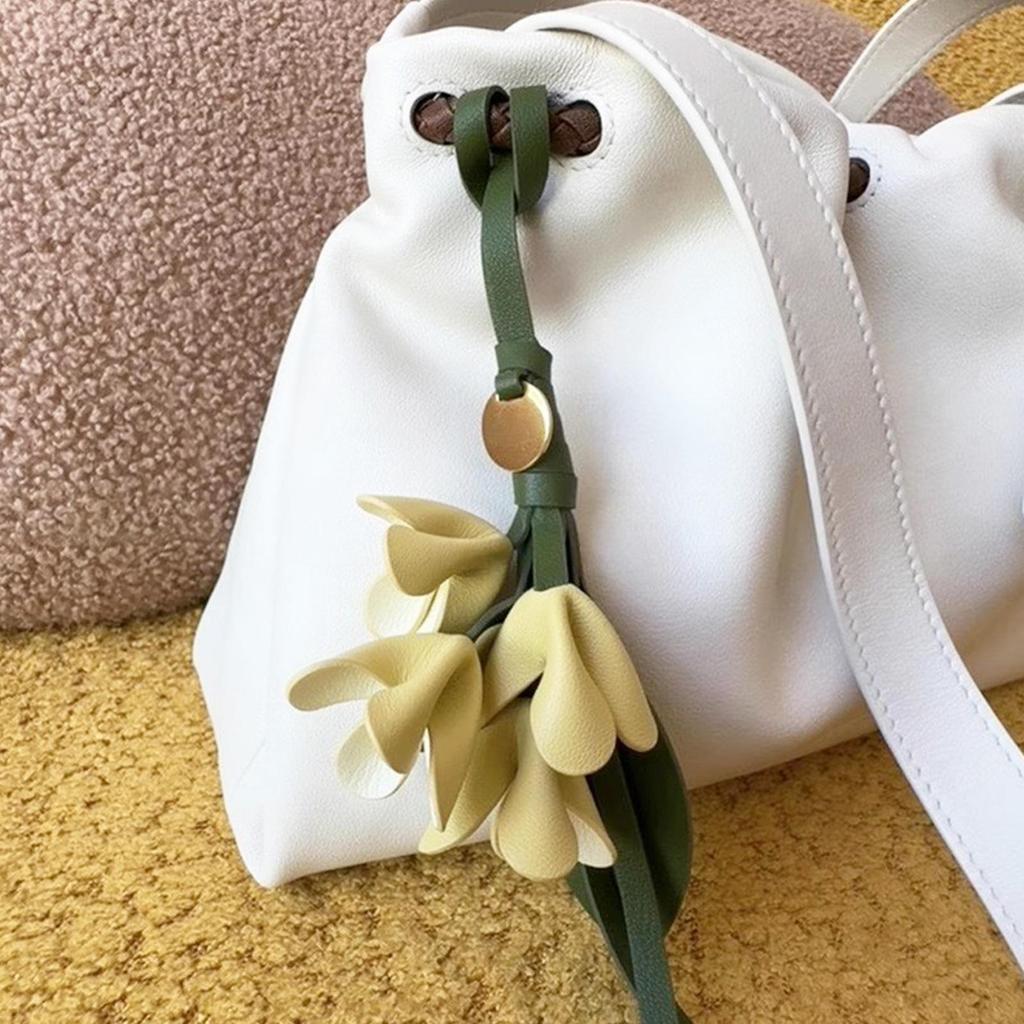 Stylish PU Leather Keychain Pendant Realistic Artificial Osmanthus Flower Design for Bags Backpacks and Accessories