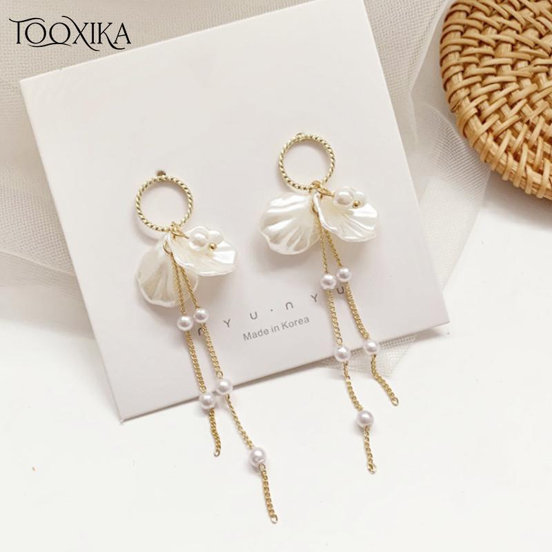 

Серьги Tooxika с жемчужными лепестками. Темпераментные серьги с жемчужными лепестками. Длинные серьги с жемчужными лепестками с кисточками.