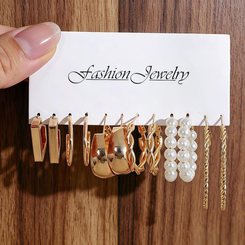 Boucles d'Oreilles Créoles Lisses Torsadées - Design Rétro, Finition Haut de Gamme, Style Niche Riz Sept Grains