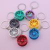 Creative Car Wheel Hub Keychain: Zinc Alloy Metal, Customizable Gift.