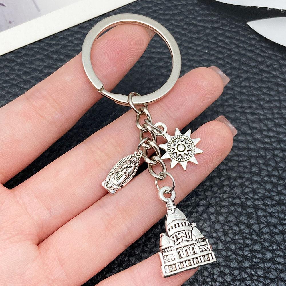 Ancient Silver Castle Sun Statue Zinc Alloy Keychain - Creative Backpack Accessory and Commemorative Pendant.