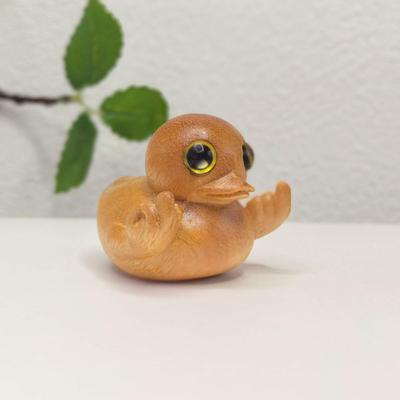 Lustige Goldene Sandelholz-Entenfigur mit Mittelfinger-Geste