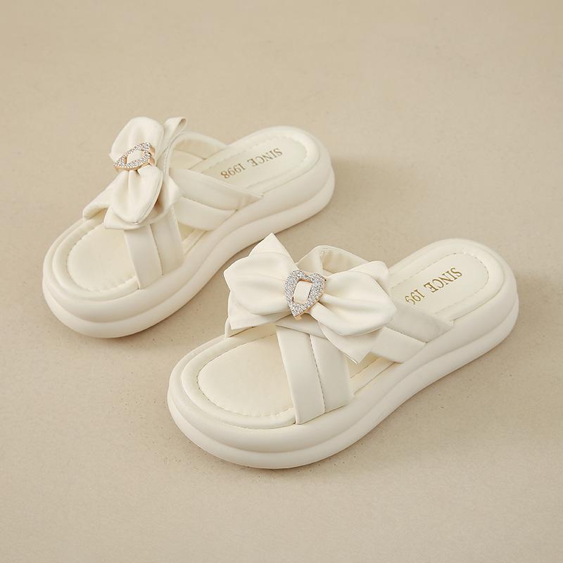Stepping on shit slippers fairy style women's models 2025 summer new models wear thick-bottomed bows with skirts cool slippers