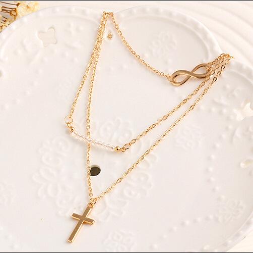 Trendy temperament Multi-layer metal cross inverted 8 collarbone chain Rice bead versatile necklace