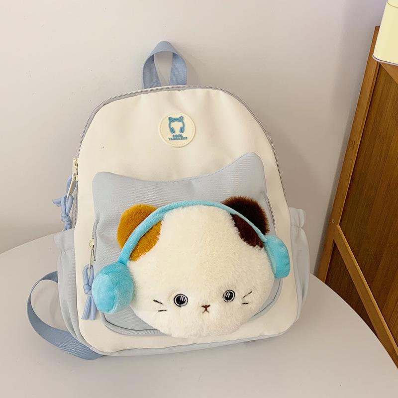 Cute Cartoon Trendy Backpack: Large Capacity, Lightweight, Versatile Travel/School Bag with Earphone and Doll Holder.