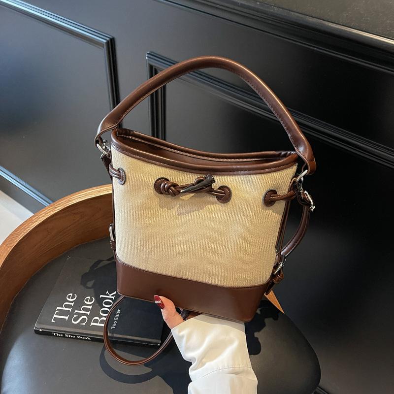 Premium sense simple retro bucket bag women's 2025 summer new messenger bag casual portable shoulder bag