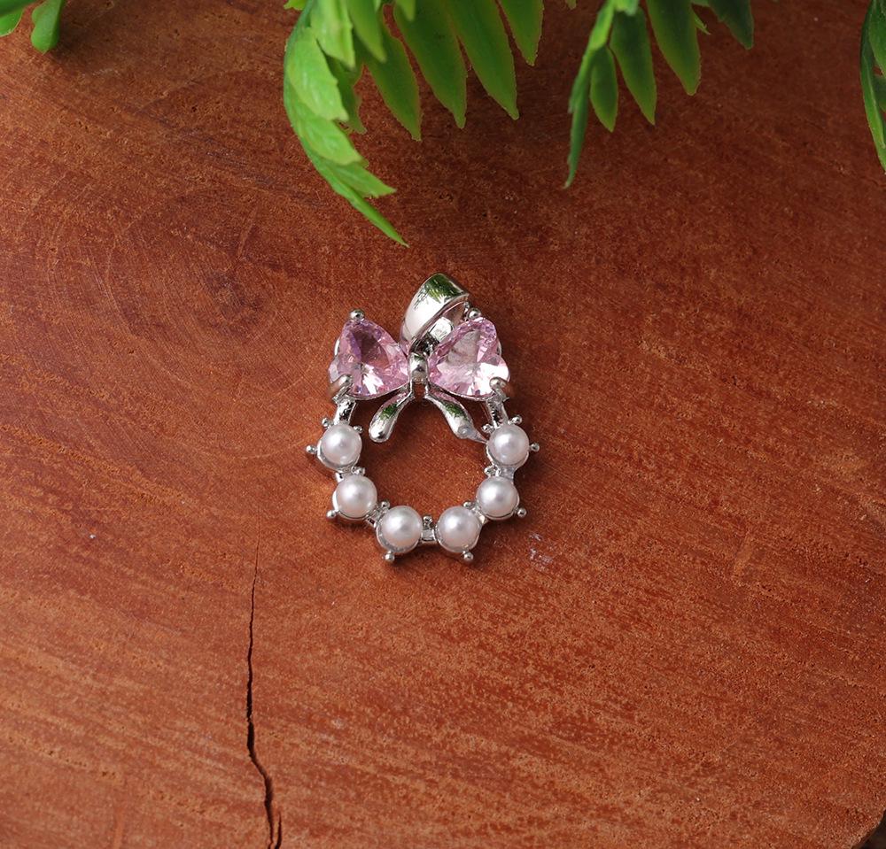 

Sweet Pink Pearl Bow Pendant with Electroplated Two-Color Stone and Round Ring - Elegant Niche Design for Women