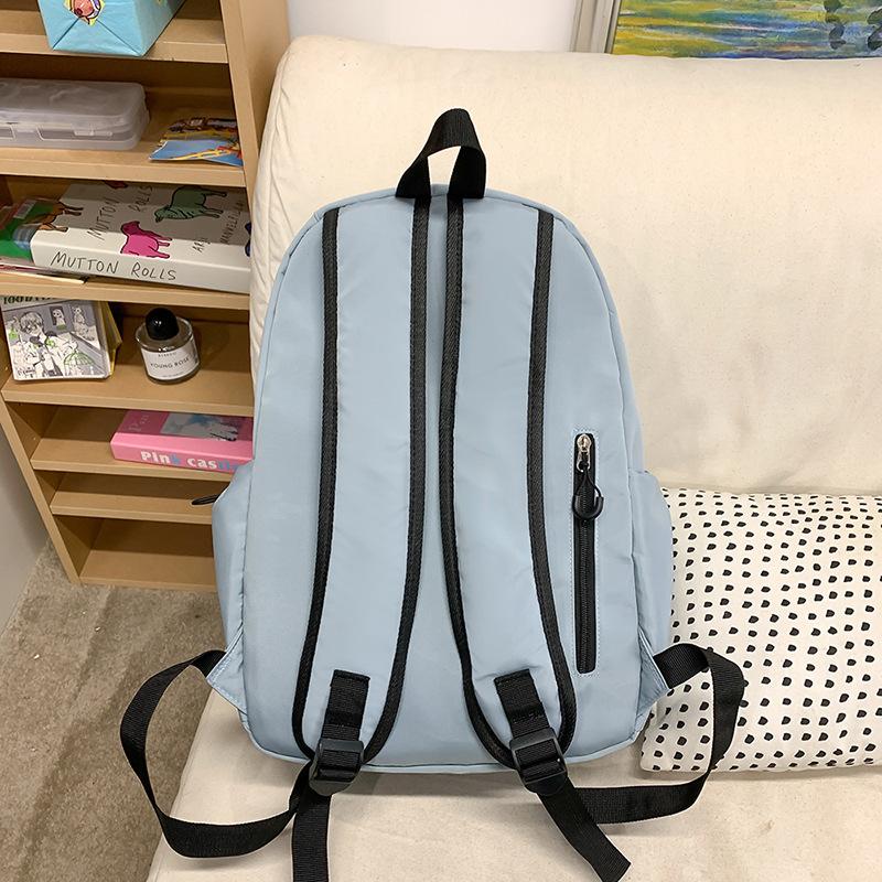 School bag solid color letter fashion backpack Korean version college student lightweight school bag outdoor travel large capacity backpack