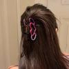 One elegant heart-shaped hairpin, a half-tied hairpin, a stylish hairpin, and a shark clip at the back of the head