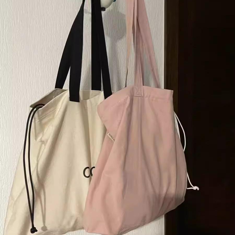 College students commute to class shoulder bag 2024 new large-capacity lazy style versatile tote bag drawstring armpit bag