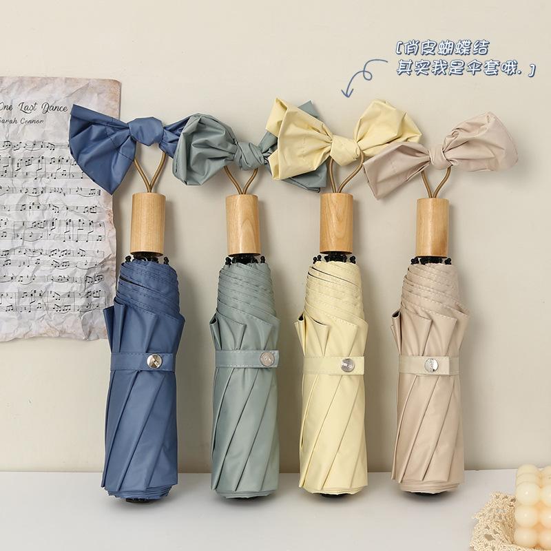Three-fold eight-bone simple plain windproof creative solid wood handle female vinyl parasol small fresh umbrella