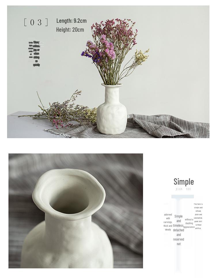 White Ceramic Vase with Dried Baby's Breath for Living Room or Dining Table Decoration