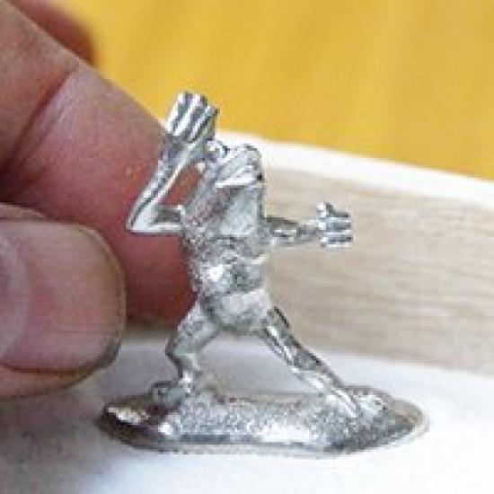 A miniature tin frog from the Choju Jinbutsu Giga perfect for your dry landscape painting, garden.