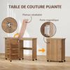 Folding sewing table, sewing furniture with drop-down leaf, storage bins, open shelf and casters, brown