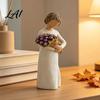 Decorative Bouquet Figurine Girl Holding Resin Figurine Faceless Lady Statue Romantic Desktop Ornament for Flower Statue Living Room Bedroom