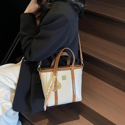 Beliebte Nischen-süße und niedliche geprägte tragbare Eimertasche Pendler lässige vielseitige Umhängetasche Tasche Frau