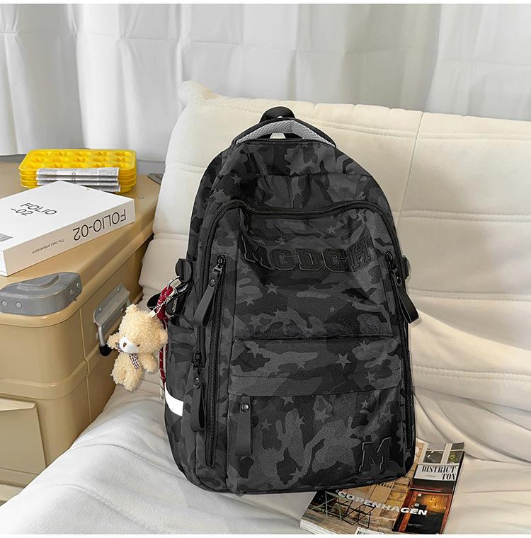 Schoolbag schoolbag female burden reduction large-capacity backpack male can hang tie rod college student travel commuter backpack tie-dye bag