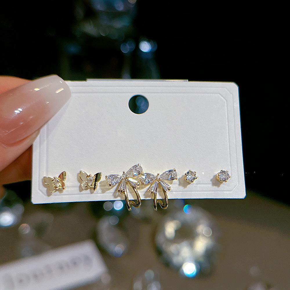 

Набор сережек-игл 925 пробы - Золотой бант и Дизайны личности, Три пары